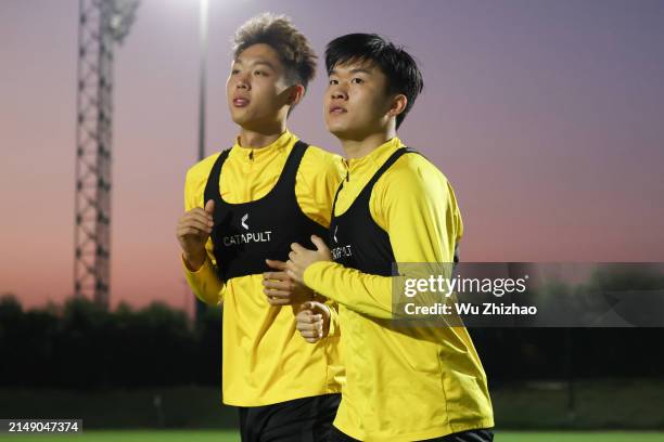 Jin Shunkai and Yang Zihao of Team China attend a training session ahead of the the AFC U23 Asian Cup 2024 Group B match between China and South...