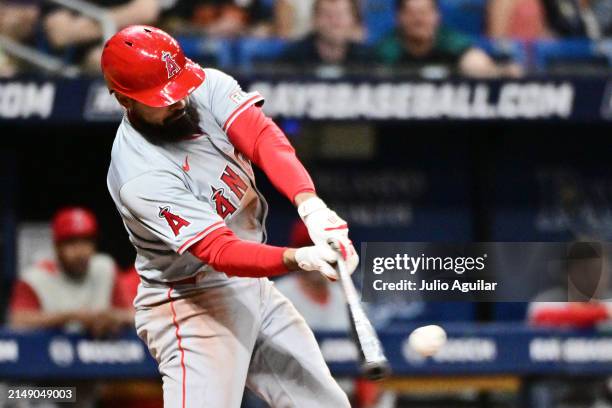 Anthony Rendon of the Los Angeles Angels hits an RBI single in the ninth inning against the Tampa Bay Rays at Tropicana Field on April 17, 2024 in St...