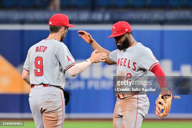 Zach Neto and Luis Rengifo of the Los Angeles Angels celebrate after defeating the Tampa Bay Rays 5-4 at Tropicana Field on April 17, 2024 in St...