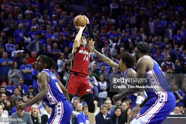 Tyler Herro of the Miami Heat shoots over Kelly Oubre Jr. #9 of the Philadelphia 76ers during the fourth quarter of the Eastern Conference Play-In...