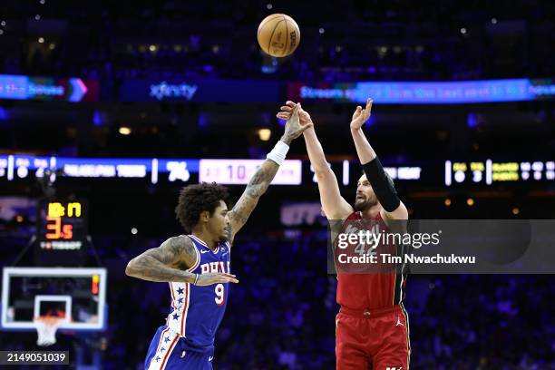 Kevin Love of the Miami Heat shoots over Kelly Oubre Jr. #9 of the Philadelphia 76ers during the fourth quarter of the Eastern Conference Play-In...