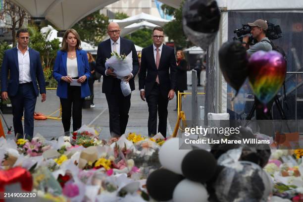 Richard Shields, Kellie Sloan, Australian Opposition Leader Peter Dutton and Senator Andrew Bragg lay flower tributes at the edge of Westfield Bondi...