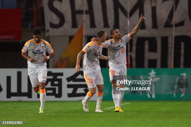 Douglas Vieira of Shimizu S-Pulse celebrates with teammates Mitchell Duke and Freire after scoring the team's first goal during the J.League J1 match...