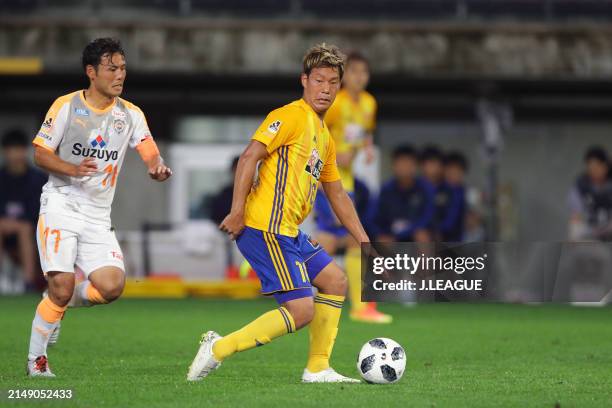 Gakuto Notsuda of Vegalta Sendai controls the ball against Yosuke Kawai of Shimizu S-Pulse during the J.League J1 match between Vegalta Sendai and...