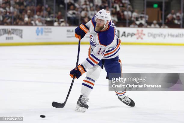 Mattias Ekholm of the Edmonton Oilers shoots the puck against the Arizona Coyotes during the first period of the NHL game at Mullett Arena on April...