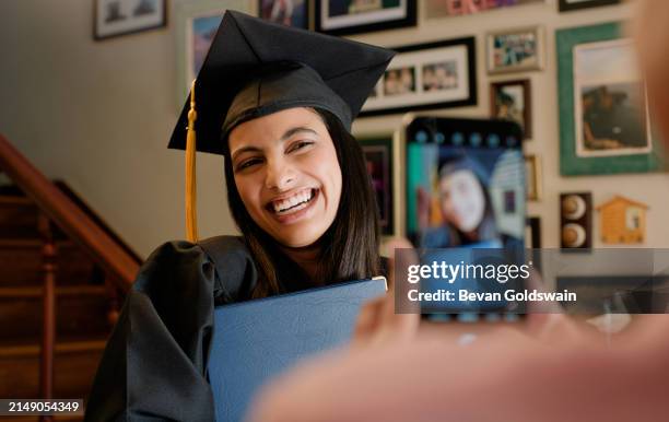 girl, student and happy for graduation with phone, screen and post achievement on web in home. person, woman and smile for memory, photography and diploma for education, learning and future at house - blogging stock pictures, royalty-free photos & images