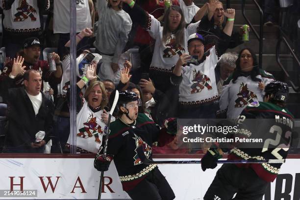 Matias Maccelli of the Arizona Coyotes celebrates with Jack McBain after scoring a goal against the Edmonton Oilers during the second period of the...