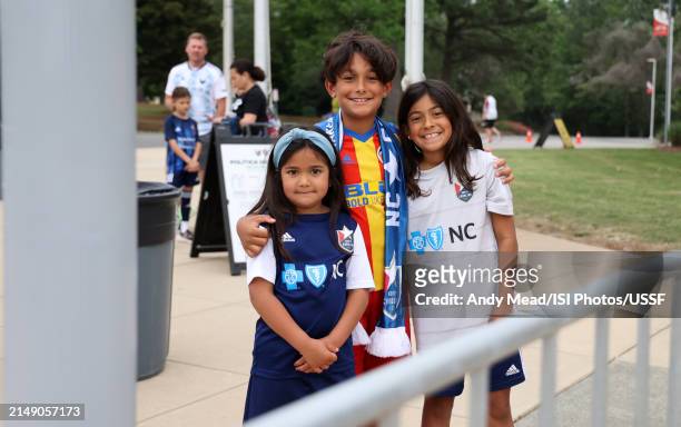 Young fans pose for a photo while waiting to get into the stadium during the U.S. Open Cup third round game between North Carolina FC and Carolina...