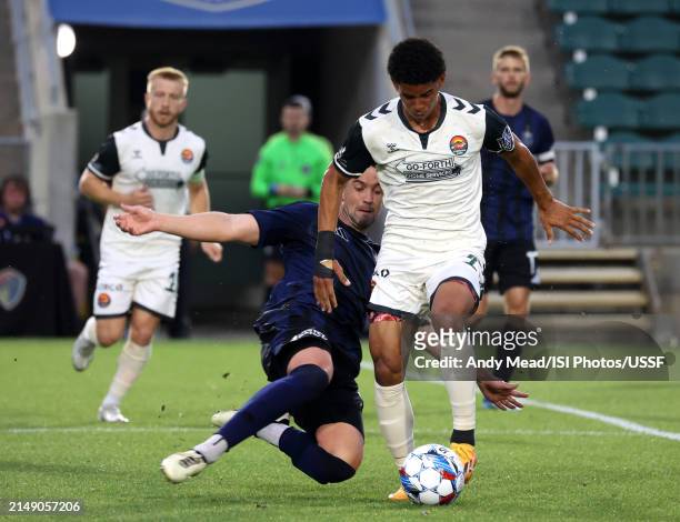 Daniel Navarro of North Carolina FC tries to tackle the ball away from Joshua Rodriguez of Carolina Core FC during the U.S. Open Cup third round game...