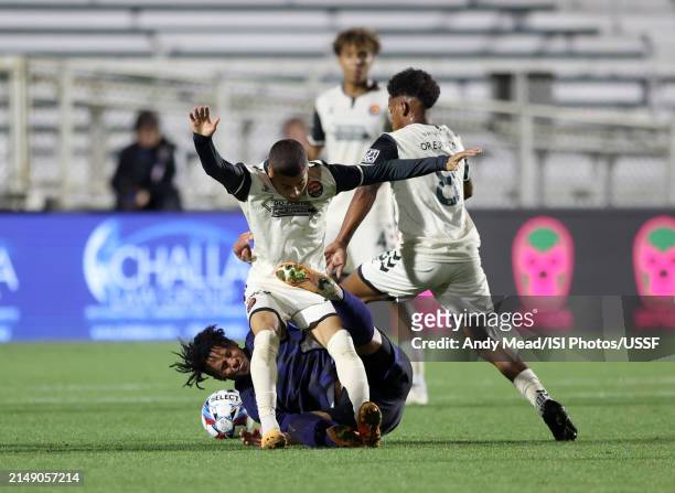 Derek Cuevas of Carolina Core FC gets tangled up with Jaden Servania of North Carolina FC during the U.S. Open Cup third round game between North...