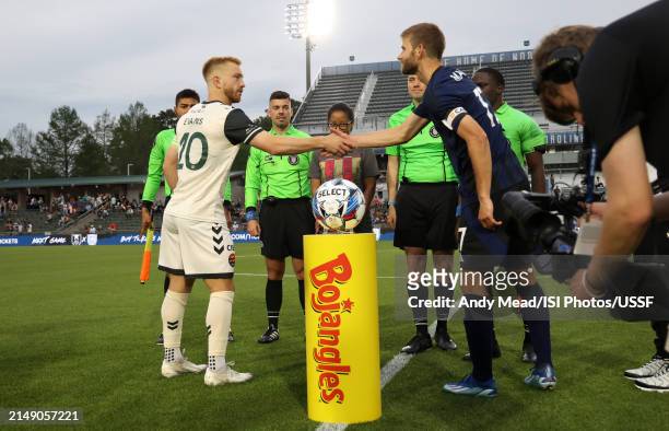 Captains Jacob Evans of Carolina Core FC and Collin Martin of North Carolina FC shake hands during the U.S. Open Cup third round game between North...