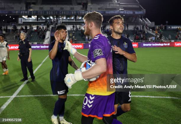 Alex Sutton of Carolina Core FC shakes hands with North Carolina FC players after the U.S. Open Cup third round game between North Carolina FC and...