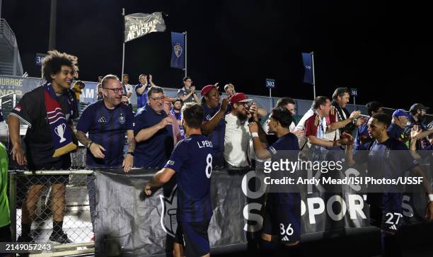 North Carolina FC players celebrate with their supporters after the U.S. Open Cup third round game between North Carolina FC and Carolina Core FC at...