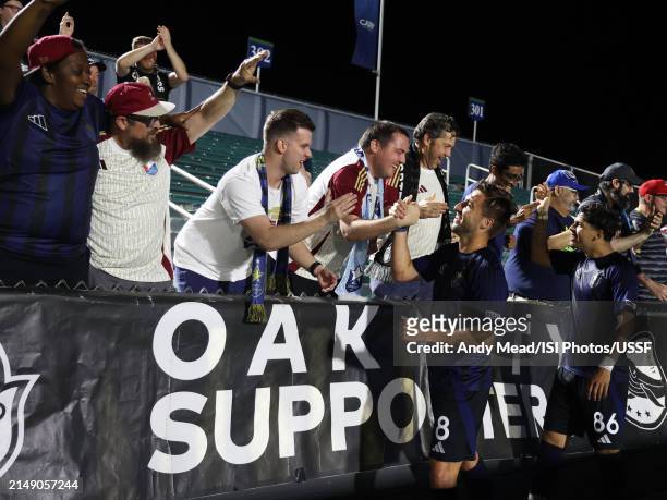 North Carolina FC players celebrate with their supporters after the U.S. Open Cup third round game between North Carolina FC and Carolina Core FC at...