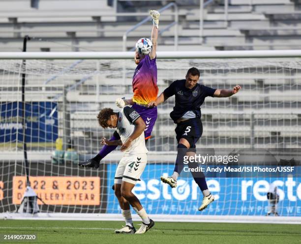 Alex Sutton of Carolina Core FC knocks the ball away from Daniel Navarro of North Carolina FC during the U.S. Open Cup third round game between North...
