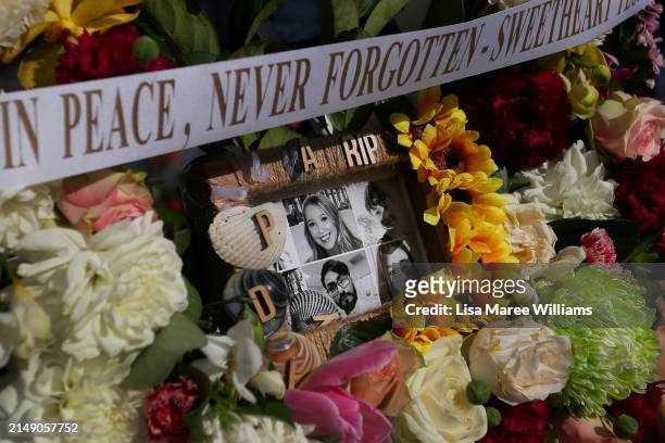 Flower tributes and condolence messages are seen at the edge of Westfield Bondi Junction during a day of reflection on April 18, 2024 in Bondi...