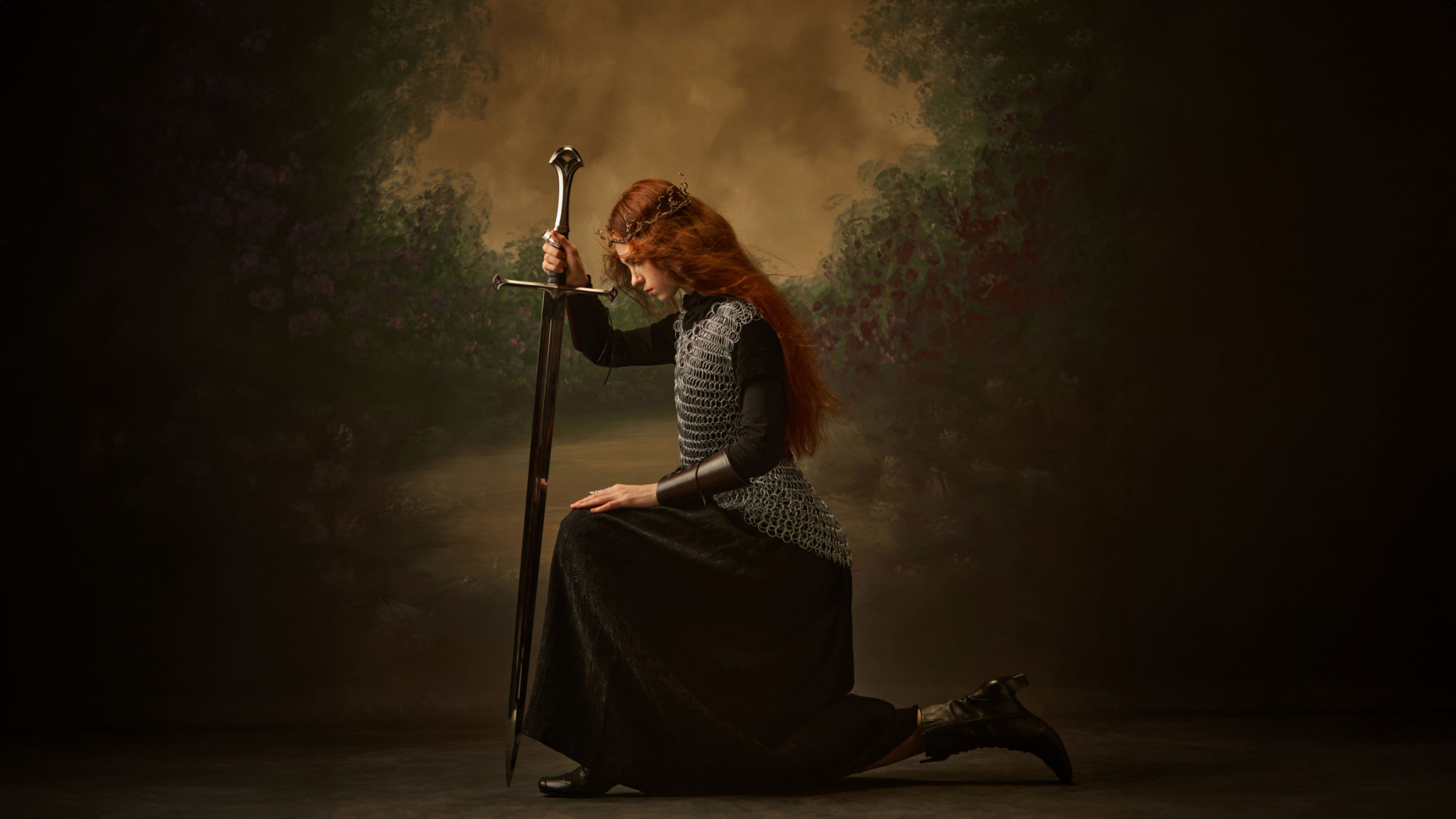 Pensive warrior princess, woman kneeling with sword, in contemplative pose against vintage background. Pensive warrior princess, woman kneeling with sword, in contemplative pose against vintage background.