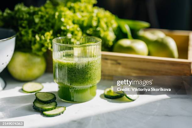 detox diet concept: green vegetables on wooden table - frullato alla frutta foto e immagini stock