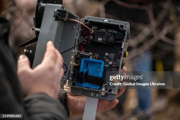 Man shows EW devices during a presentation on March 19, 2024 in Ukraine. During the 'Protect Warrior from Drone' event, Kvertus showed off electronic...