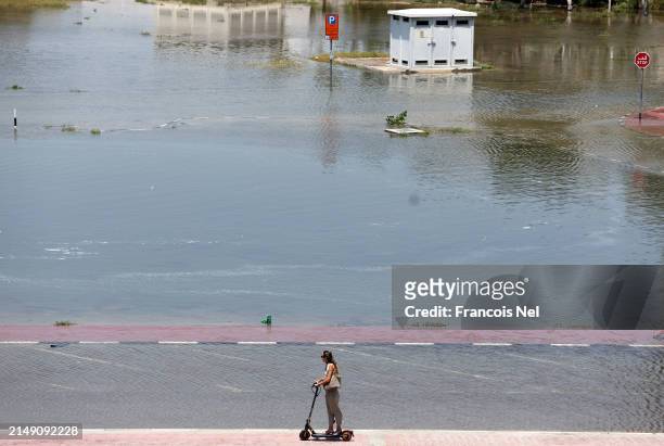 General view of a flooded parking lot can be seen on April 18, 2024 in Dubai, United Arab Emirates. Atypically heavy rains in the UAE on Monday and...