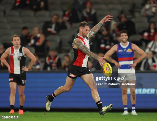 Tim Membrey of the Saints kicks on goal during the round six AFL match between St Kilda Saints and Western Bulldogs at Marvel Stadium, on April 18 in...