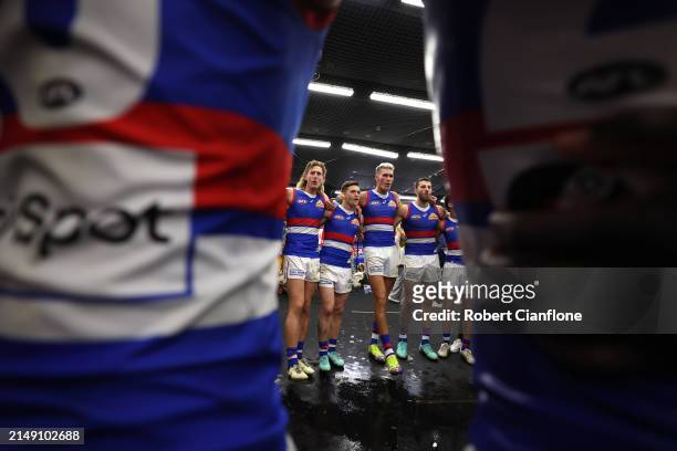The Bulldogs celebrate after they defeated the Saints during the round six AFL match between St Kilda Saints and Western Bulldogs at Marvel Stadium,...