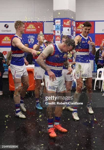 James Harmes of the Bulldogs celebrates with team mates after the Bulldogs defeated the Saints during the round six AFL match between St Kilda Saints...