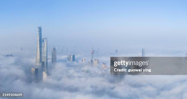 aerial view of shanghai lujiazui in stratospheric clouds - clouds from aircraft point of view stock pictures, royalty-free photos & images