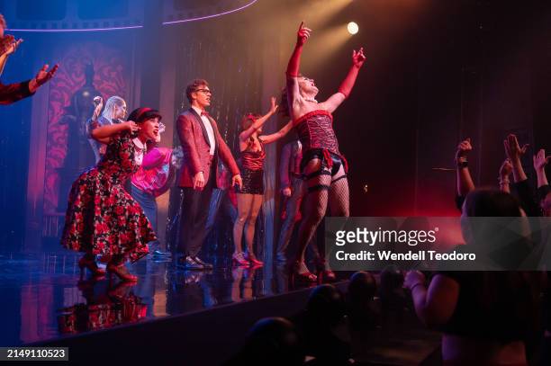 Jason Donovan, Pete Helliar and the cast is seen on stage during the curtain call for The Rocky Horror Show at the Theatre Royal on April 18, 2024 in...