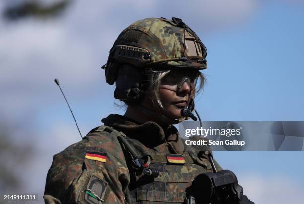Female member of a mechanized infantry unit of the Bundeswehr, the German armed forces, takes part in the "National Guardian" military exercise at...