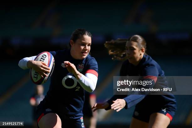 Jess Breach runs with the ball during a England Red Roses Training Session at Twickenham Stadium on April 18, 2024 in London, England.