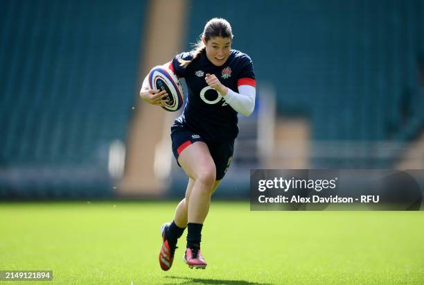 Jess Breach runs with the ball during a England Red Roses Training Session at Twickenham Stadium on April 18, 2024 in London, England.