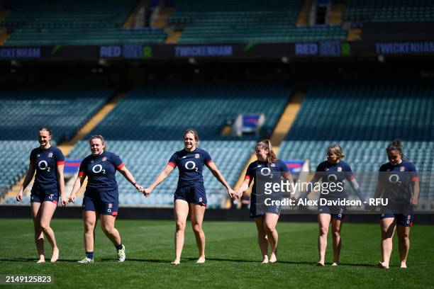 Members of the team walk across the pitch during a England Red Roses Training Session at Twickenham Stadium on April 18, 2024 in London, England.