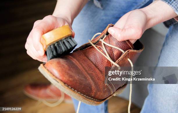 cleaning shoes - leather boot stock pictures, royalty-free photos & images