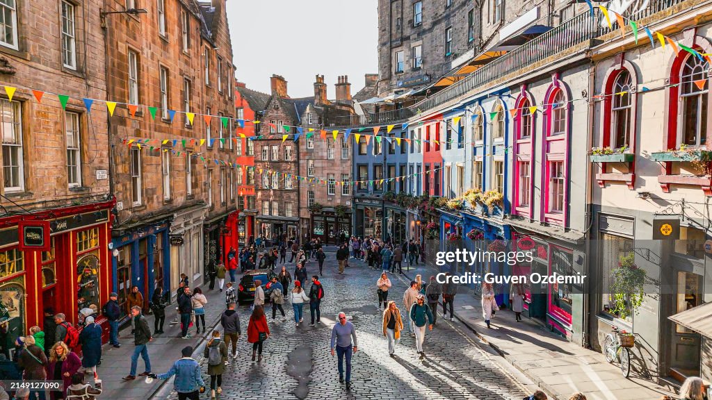 Aerial view of the famous colorful Victoria Street in the Old Town of Edinburgh, Scotland, England, Victoria Street in the United Kingdom, Victoria Street in the old town in Edinburgh Scotland England Crowds of tourists on the Royal Mile,harry potter city