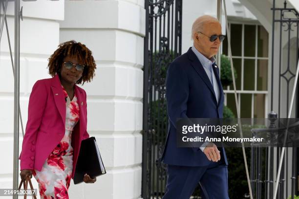 President Joe Biden walks to board Marine One with White House Press Secretary Karine Jean-Pierre on the South Lawn of the White House on April 18,...