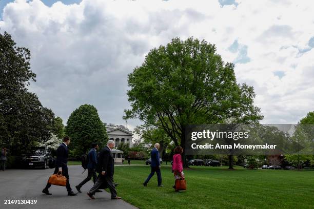 President Joe Biden walks to board Marine One with senior members of his staff on the South Lawn of the White House on April 18, 2024 in Washington,...