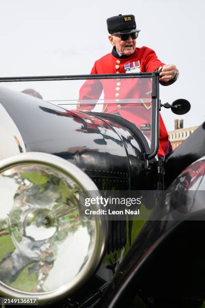 Chelsea Pensioner Bill Bailey sits in a 1925 Bentley 3 litre Supersports following its appearance in the parade on the press day of the Salon Privé...