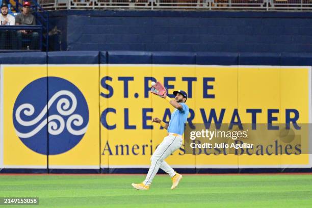 Jose Siri of the Tampa Bay Rays looks to catch a fly ball off the bat of Anthony Rendon of the Los Angeles Angels in the third inning at Tropicana...