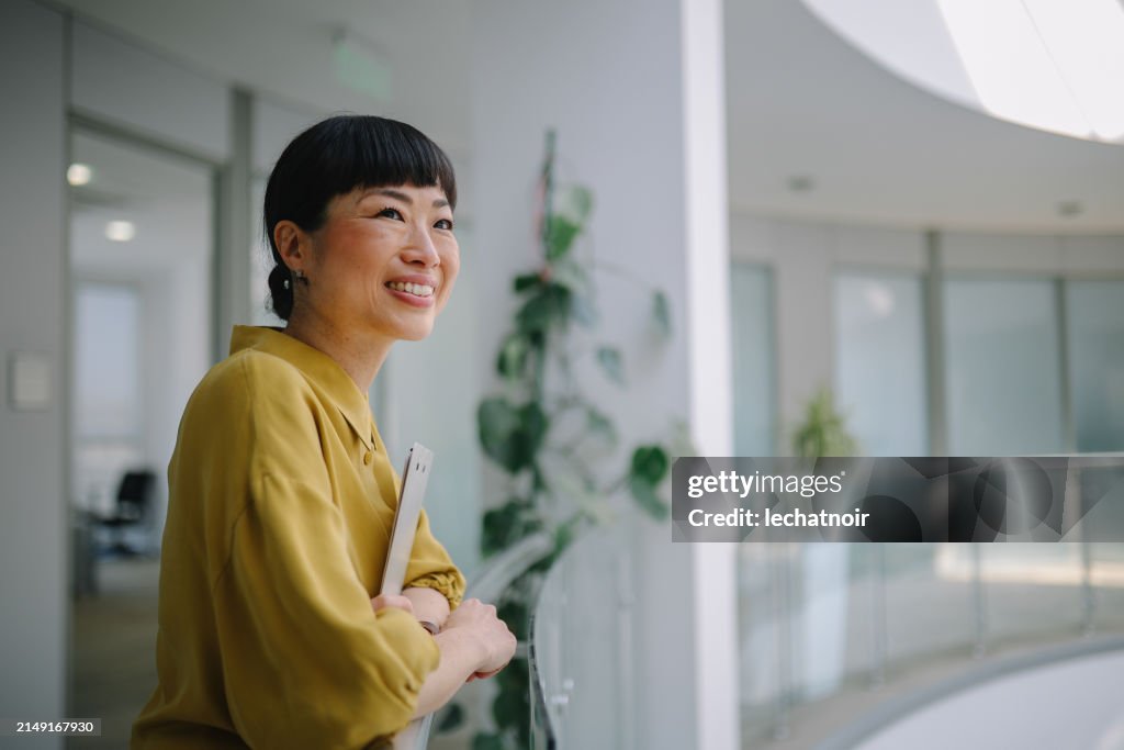 Asian corporate employee portrait in office environment