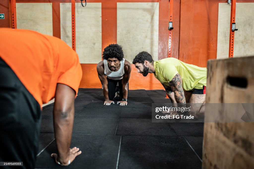 Men stretching at the gym