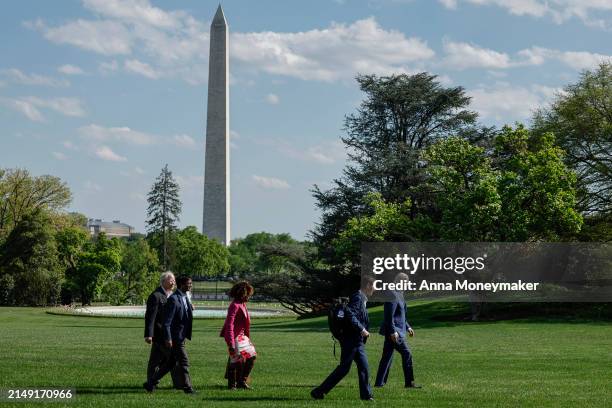 President Joe Biden walks on the South Lawn after landing on Marine One with senior members of his staff at the White House on April 18, 2024 in...