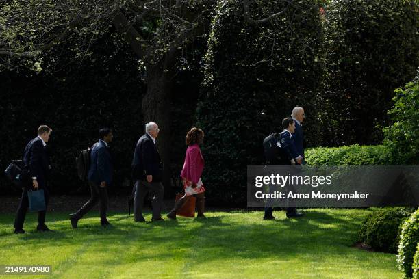 President Joe Biden walks on the South Lawn after landing on Marine One with senior members of his staff at the White House on April 18, 2024 in...