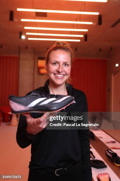 Charlotte Heidmann, Senior Product Manager, adidas, holds the new Adizero Prime SP 3 Strung at a global launch event for adidas' Paris 2024 team kits...