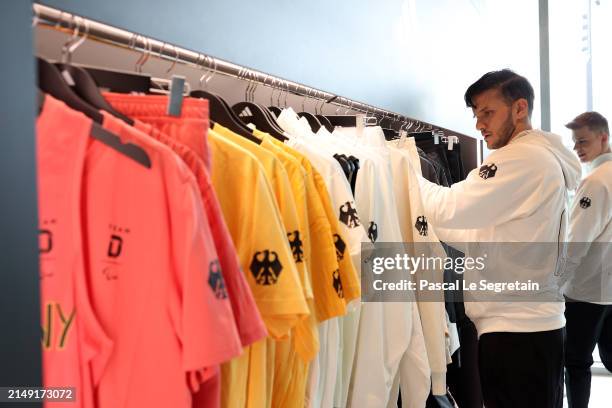 World-class athlete Ali Lacin is captured here viewing the new adidas kits for Team D at Paris 2024. All adidas Paris 2024 kits were unveiled at a...