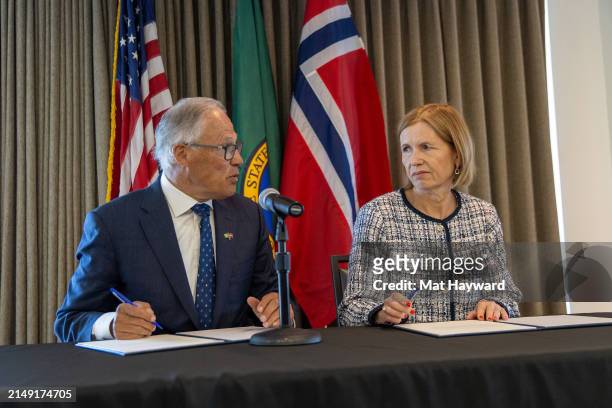 Washington Governor Jay Inslee and Norway's ambassador to the United States Anniken Krutnes speak before signing a joint statement on climate action,...