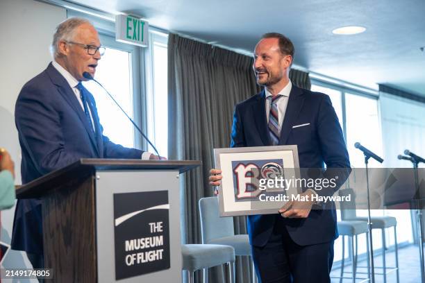 Washington Governor Jay Inslee presents Norwegian Crown Prince Haakon with a certificate recognizing him as an honorary Ballard High School Beaver at...