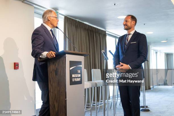 Washington Governor Jay Inslee speaks with Crown Prince Haakon of Norway before presenting him with a certificate recognizing him as an honorary...