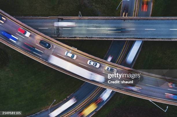 rush hour on highway interchange - overhead view of car stock pictures, royalty-free photos & images