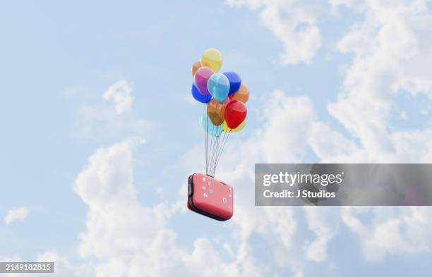 flying suitcase - disney balloons stock pictures, royalty-free photos & images
